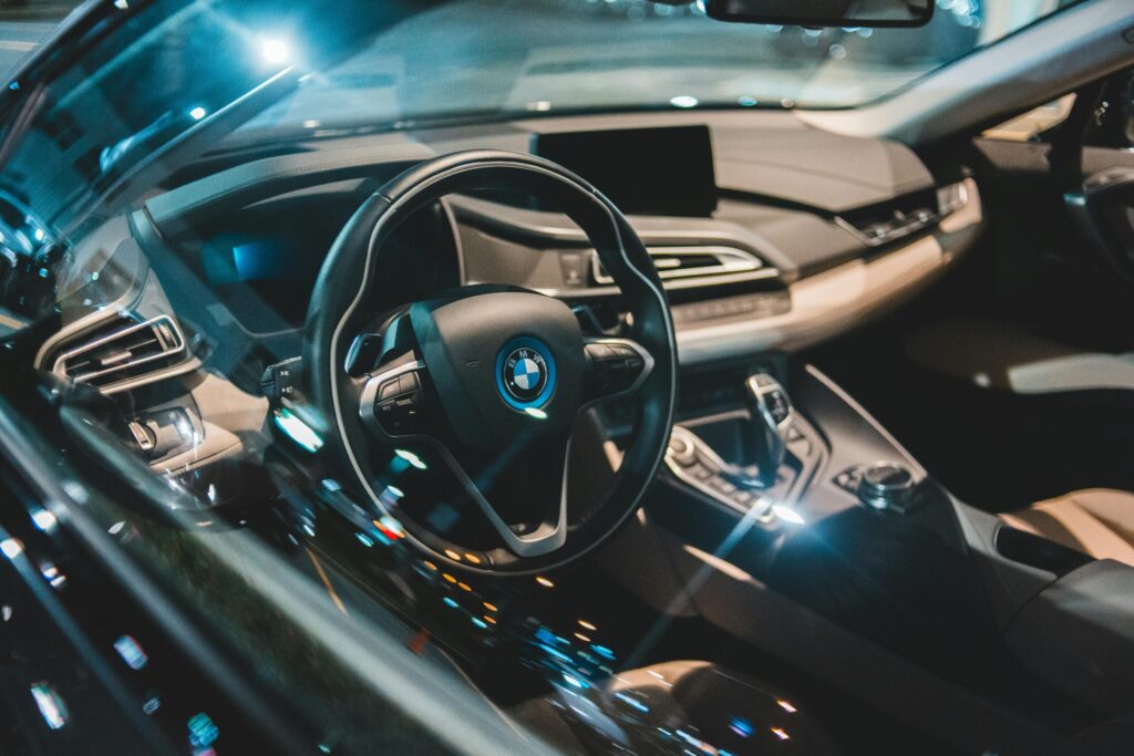 Black interior of contemporary expensive empty automobile with shiny windows and modern panel